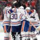 Oilwers players celebrate their win in the middle of the ice.