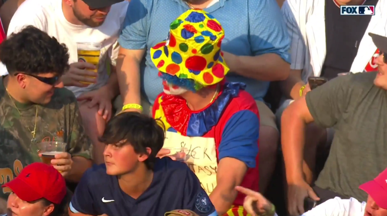 Jason Benetti and AJ Pierzynski didn't miss the chance to laugh at a fan serving his fantasy football punishment in clown attire. Photo Credit: Fox