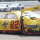 NASCAR Cup Series driver Joey Logano (22) is towed after crashing in the first turn Sunday, July 21, 2024, during the Brickyard 400 at Indianapolis Motor Speedway.